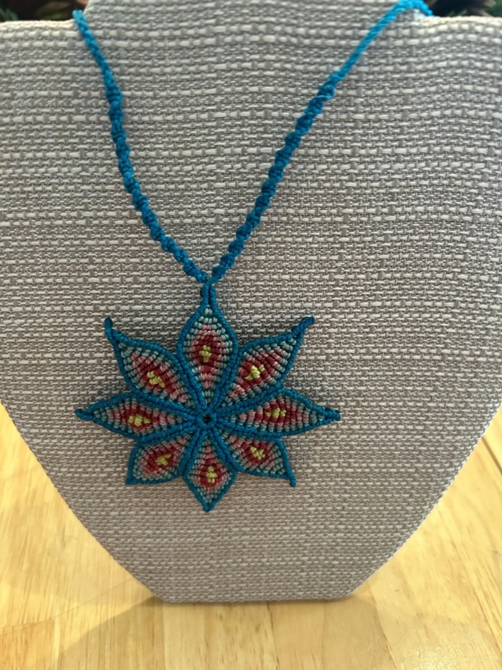 Handmade Rich Blue Macrame Flower Necklace with Red and Yellow Accents - Picture 6 of 6